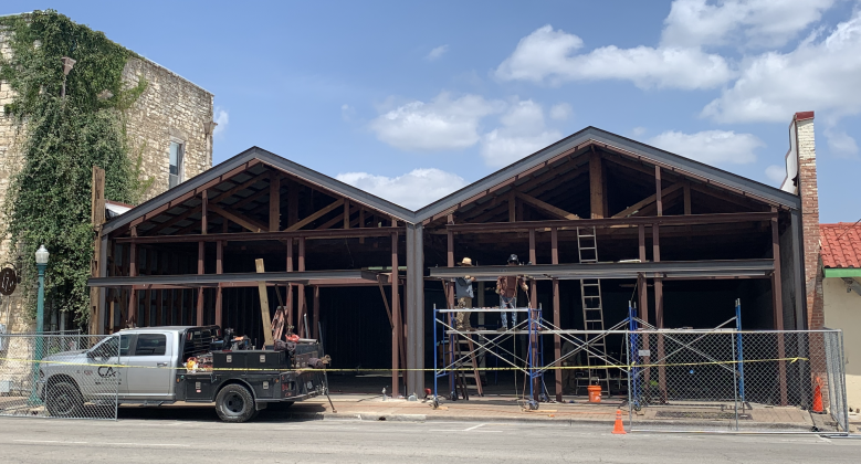 Contractors renovate a downtown space at 817 South Austin Avenue July 29. Projects like this in the future will have to follow updated Unified Development Code standards for downtown structures. New Georgetown building and environmental rules will go into effect this November. (Photo by Kaitlyn Wilkes)