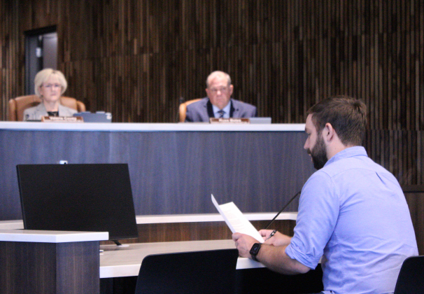 Carlson Place resident James Headrick, front, expresses his opposition to the Justice Complex property to the Williamson County Commissioners Court, August 4. Photo by Nalani Nuylan.