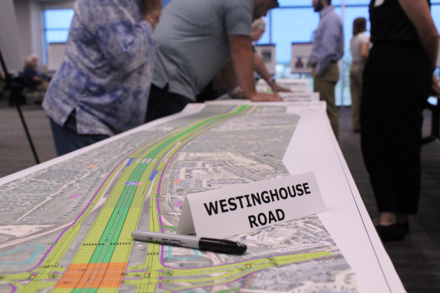Residents analyze and ask questions about the proposed Interstate Highway 35 schematics during a Texas Department of Transportation open house in the evening at the Georgetown Annex, Thursday, August 13. Photo by Nalani Nuylan.