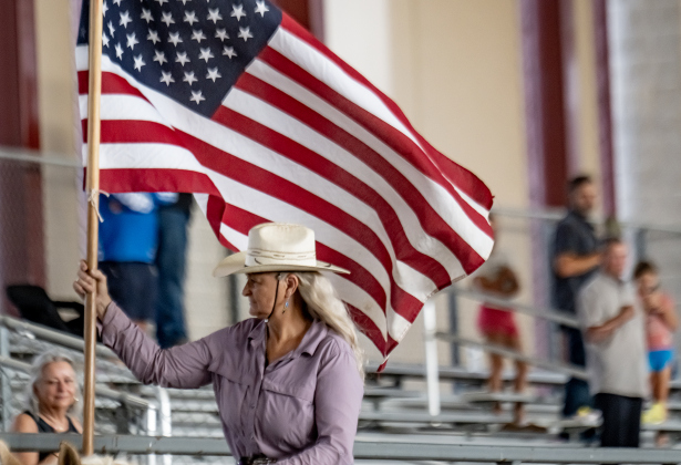 Debbie Starr of Lockhart, Texas carries the American flag for  the National Anthem   during the Texas Senior Pro Rodeo Association’s Rodeo held Sunday, August 16, 2026  at the Williamson County Expo Center.