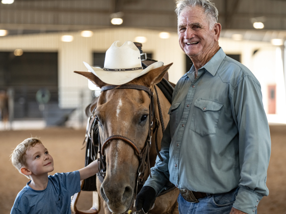 Ed Denison of Hockley, Texas, who will be 80 in October, introduces his horse called Hombre to his 8-year-old grandson Levi Bentley  during the Texas Senior Pro Rodeo Association’s Rodeo held Sunday, August 16, 2026  at the Williamson County Expo Center.