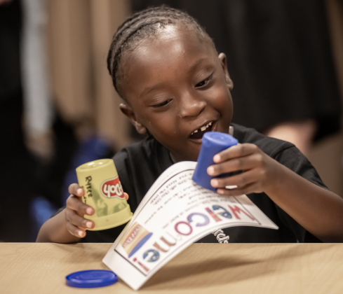 Kindergartener Ronald Pierre Jr., who will be 5 on Sunday, has fun in his classroom on Wednesday, August 19, 2026,  the first day of classes at George Washington Carver Elementary School.