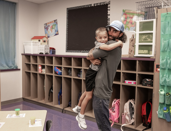 Dad Bruce Velez gives a goodbye hug to his son Camden, 6, on Wednesday, August 19, 2026,  the first day of classes at George Washington Carver Elementary School.