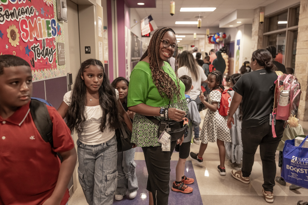 Principal Charlotte Young greets families on Wednesday, August 19, 2026,  the first day of classes at George Washington Carver Elementary School.