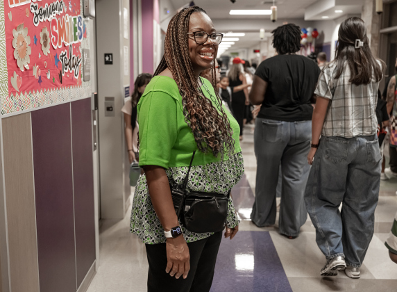 Principal Charlotte Young greets families and students  on Wednesday, August 19, 2026,  the first day of classes at George Washington Carver Elementary School.