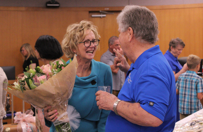 Judge Lambeth laughs at a joke Georgetown City Council Member Ron Garland said during the reception of her retirement celebration. Photo by Nalani Nuylan.