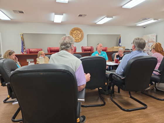 Florence Mayor Ben Daniel, center, listens to developer Robert Peerman, front left, provide a status update on the Nightingale subdivision during a special City Council workshop on July 27. Photo by Nalani Nuylan.