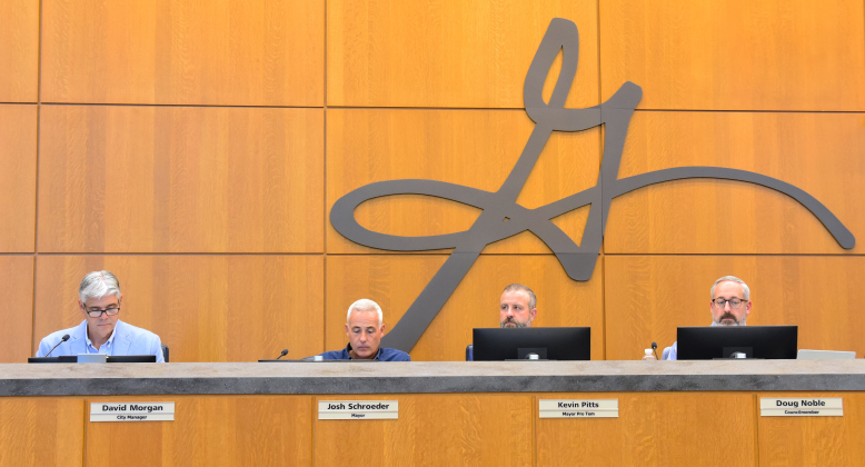 From left, David Morgan, city manager, Josh Schroeder, mayor, Kevin Pitts, council member and Doug Noble, council member, listen to the first reading of the 2027 Fiscal Year budget on August 25. (Photo by Kaitlyn Wilkes)