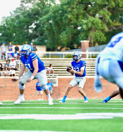 Quarterback Kaleb McDougle drops back for a pass.  Photos by Lawson Richter