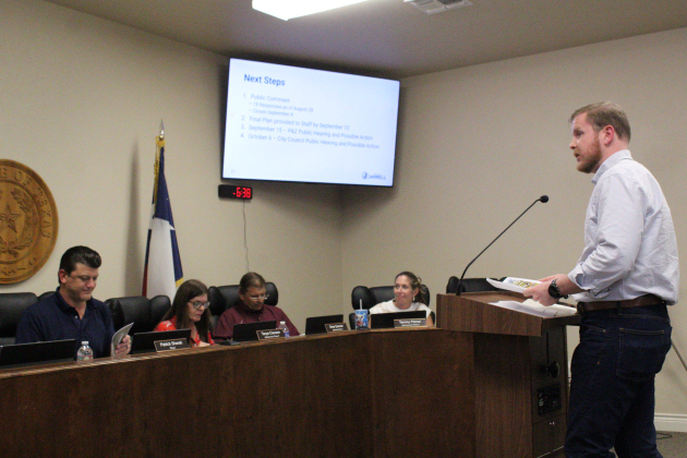 Ethan Harwell, a planner with engineering firm Kimley Horn, presents a preliminary Downtown Master Plan for the City of Jarrell during a joint city council and planning and zoning meeting, September 1. Photo by Nalani Nuylan.