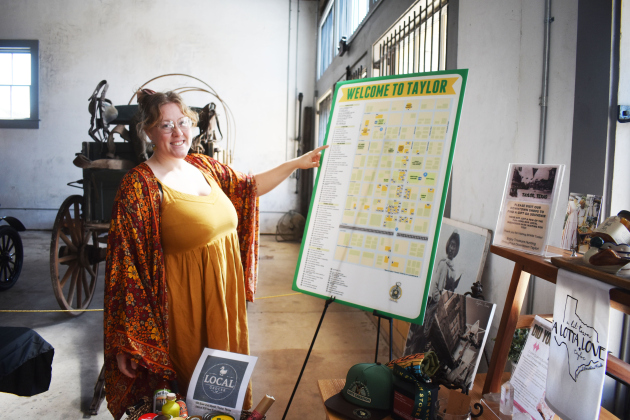 Ruby Fisher, Taylor’s Special Events Coordinator, welcomes visitors to the Sesquicentennial activity — Spark! — a museum exhibit that tells the story of the small town on Texas’ Blackland Prairie. The exhibit is open through September 26. Photo credit Katherine Hamilton
