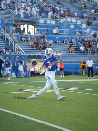 Cade Erickson reaches for a downfield catch before a big gain.  Photos by Lawson Richter