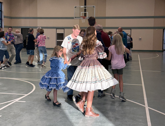 Children dancing with adults dancing in the background at Shirts ‘n’ Skirts on August 26.