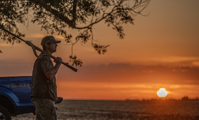 Kyle McAllen of Shreveport watches the eastern sky as the sun rises over County Road 409 in Williamson County just after 7a.m. on Tuesday, September 1, 2026, the opening day of dove season in Central Texas.  Photo by Andy Sharp.