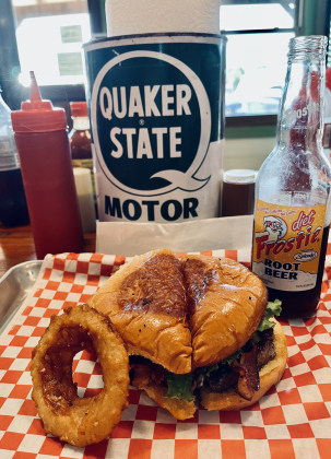 A photo, taken at a 45-degree angle, shows burger, cheese and bacon tucked into the bun. Photo by Linda Dwyer