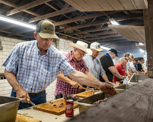 A crew prepares smoked meats for meals  during the Fall Bazaar held at Saints Cyril & Methodius Catholic Church  on Sunday, September 6, 2026. 