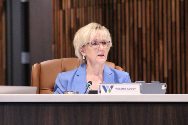 Williamson County Commissioner Valerie Covey of Precinct 3 explains the resolution to lower the debt cap for the Somerset Hills Road Districts 3 and 4 during the Road District Commissioners Court meeting, September 29. Photo by Nalani Nuylan.