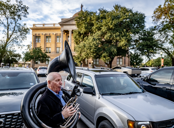 Bill Troiano, a member of the group Swing Shift plays his Sousaphone along 8th Street during the Georgetown’s Art Stroll on Friday, October 16, 2026. Photo by Andy Sharp