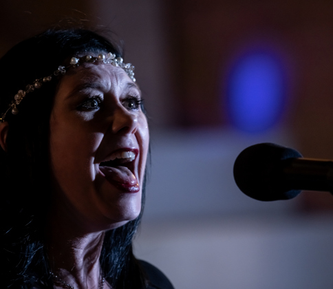Jaymie Graves, singer with “Last of the Petty Cash” performs during the First Friday free concert held on the Williamson County Courthouse lawn on Friday, October 16, 2026. Rain moved the October concert to this Friday. One more First Friday concert will be held in November. Photo by Andy Sharp