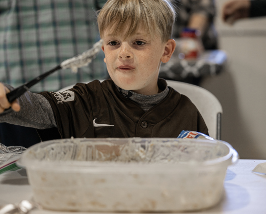 7-year-old Evan Makal had the good fortune to finish off the last bits of a container of banana pudding during the Third Annual St. Peter Lutheran Church Hamburger Fundraiser on Saturday, October 17, 2026. A Country Store and Quilt Raffle were also held. The church is at 2929 FM 972 in Walburg. Photo by Andy Sharp