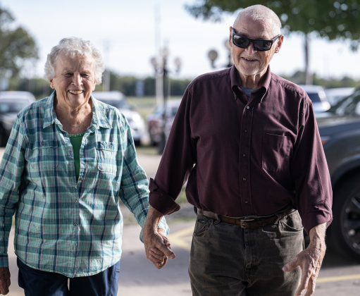 Peggy and Marvin Kelm arrive for their hamburger plates during the Third Annual St. Peter Lutheran Church Hamburger Fundraiser on Saturday, October 17, 2026. A Country Store and Quilt Raffle were also held. The church is at 2929 FM 972 in Walburg. Photo by Andy Sharp