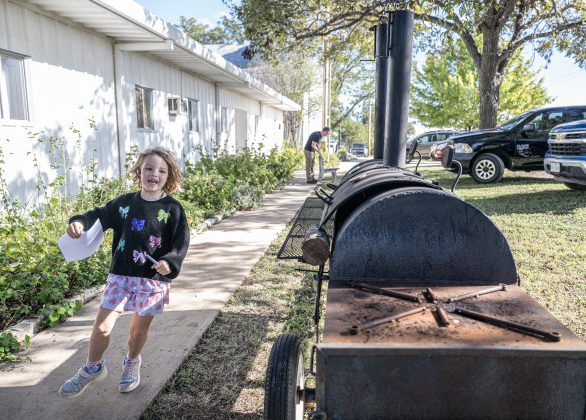 5-year-old Hannah Daniels, daughter of Pastor Philip Daniels and his wife Amy Masheter, was full of energy on a cool afternoon during the Third Annual St. Peter Lutheran Church Hamburger Fundraiser on Saturday, October 17, 2026. A Country Store and Quilt Raffle were also held. The church is at 2929 FM 972 in Walburg. Photo by Andy Sharp
