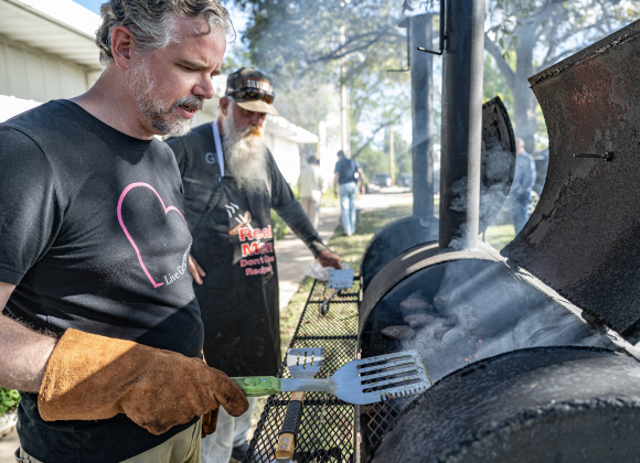 Pastor Philip Daniels, left, and Dave Reed keep a close eye on hamburgers being grilled during the Third Annual St. Peter Lutheran Church Hamburger Fundraiser on Saturday, October 17, 2026. A Country Store and Quilt Raffle were also held. The church is at 2929 FM 972 in Walburg. Photo by Andy Sharp