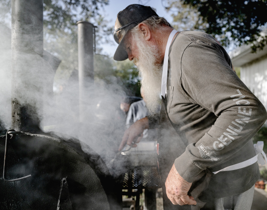 Dave Reed keeps a close eye on hamburgers being grilled during the Third Annual St. Peter Lutheran Church Hamburger Fundraiser on Saturday, October 17, 2026. A Country Store and Quilt Raffle were also held. The church is at 2929 FM 972 in Walburg. Photo by Andy Sharp