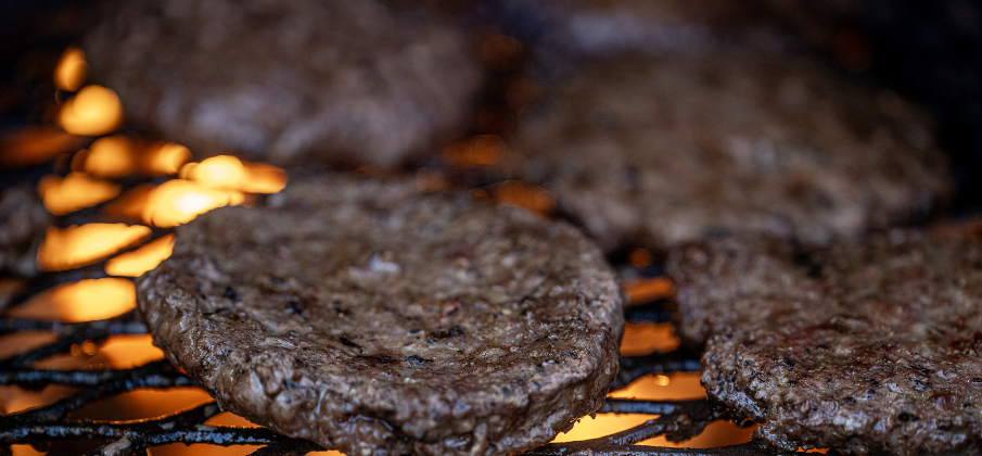 Hamburgers are grilled during the Third Annual St. Peter Lutheran Church Hamburger Fundraiser on Saturday, October 17, 2026. A Country Store and Quilt Raffle were also held. The church is at 2929 FM 972 in Walburg. Photo by Andy Sharp