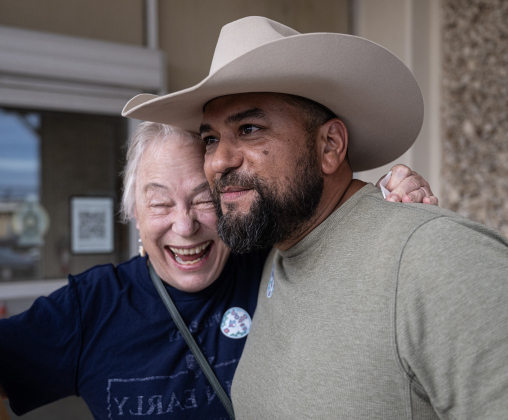 Chris Jimenez, running for Texas House District 52 gets a hug from Janetta McCoy after a group marched through downtown to Taylor City Hall on Monday, October 19, 2026. The event was coordinated by the East Wilco Democrats. Jimenez and his wife Katy cast their ballots. Photo by Andy Sharp