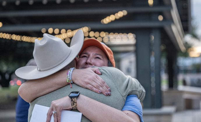 Erin Block, candidate for Williamson County Clerk, hugs Chris Jimenez, running for Texas House District 52 after a group marched through downtown to Taylor City Hall on Monday, October 19, 2026. The event was coordinated by the East Wilco Democrats. Photo by Andy Sharp