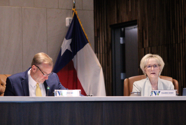 Williamson County Judge Steve Snell, left, and County Commissioner Valerie Covey talk about the need for a regional water study during the October 20 Commissioners Court meeting. Photo by Nalani Nuylan