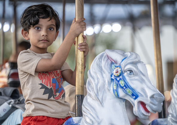 5-year-old Carlos Chavana enjoys a ride on a merry-go-round during the Williamson County Fair, held on Wednesday, October 21, 2026. The fair and the Wiliiamson County Rodeo continued through October 24th at the Williamson County Expo Center. Photo by Andy Sharp