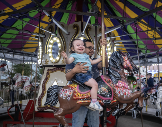 2-year-old Ashley Diaz and her father Edwin Diaz enjoyed a ride on a merry-go-round during the Williamson County Fair, held on Wednesday, October 21, 2026. The fair and the Wiliiamson County Rodeo continued through October 24th at the Williamson County Expo Center. Photo by Andy Sharp