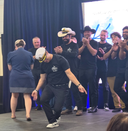 Rob Pickett, center, takes a bow as he is crowned one of the Kings of Sole for raising more than $10,000 for CASA Wilco. Photo by Nalani Nuylan.