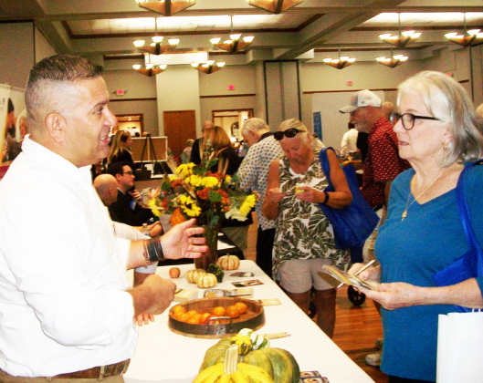 Armando Garza, from the Delaney at Georgetown, answers questions about his senior-living community off Shell Road. BRAD STUTZMAN