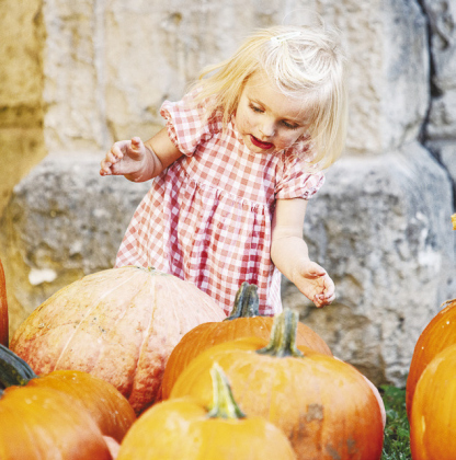 Heidi Watts, 2, was enthralled with some of the larger pumpkins.