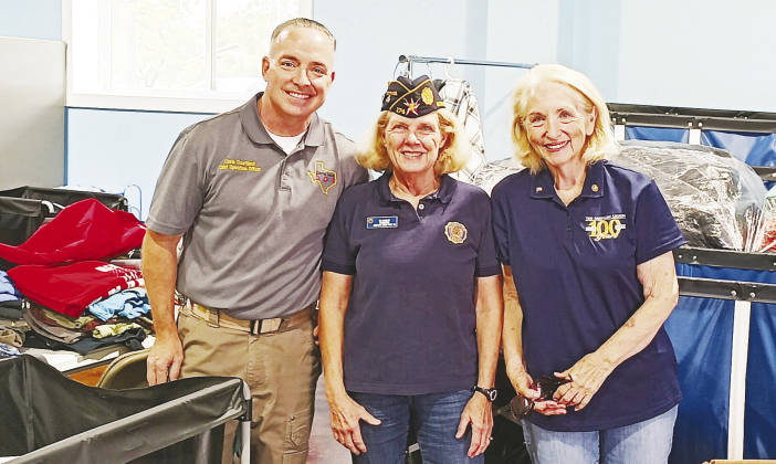 From left, Assistant Director Christopher Courtland, Post 174 Commander BJ MacMillan and Post Program Coordinator Marilyn Campbell help deliver clothes September 16. COURTESY BJ MACMILLAN