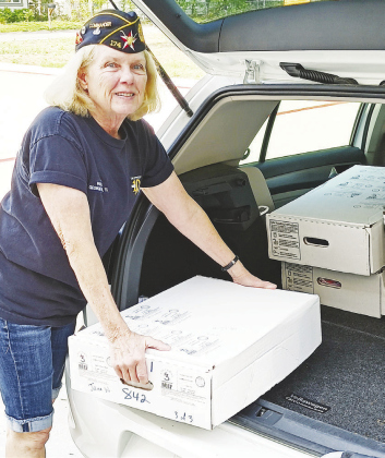 Post 174 Commander BJ MacMillan unloads a vehicle September 7.