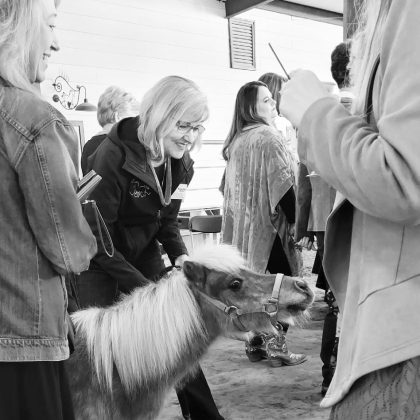 ROCK staff member Dr. Priscilla Lightsey escorts miniature horse Shimmer.