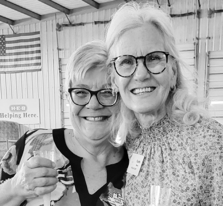 Bruncheon attendees Paula Jane Able (left) and Faith Bero attract admirers.