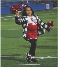Gigi Martinez shakes her poms during a show.