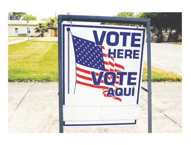 A “Vote Here” sign marks the outside of a polling location. SUN ARCHIVE