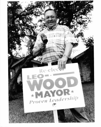 Leo Wood, who served as mayor of Georgetown from 1992-1999, positions campaign posters while running for re-election. SUN ARCHIVE