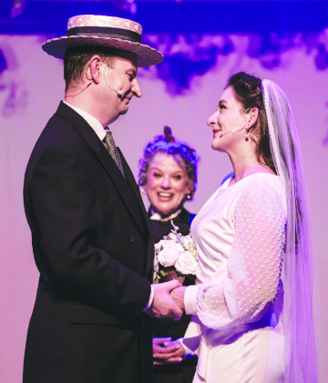 Stephen Quinn as Jim Hardy, Suzanne Orzech, back center, as Louise Badger, and Mariana Garcia playing Linda Mason in Holiday Inn, playing at the Georgetown Palace through December 30. See more on Page 11. ANDY SHARP