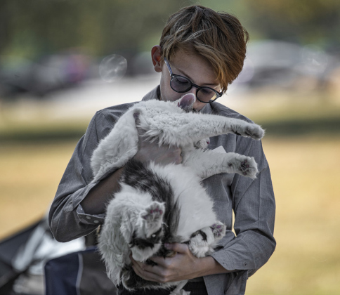 Zack Van Nostrand, 13, cuddles his 15-pound cat, Lucky.