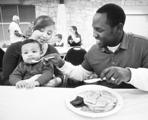 Louis and Lacey Daily, with their son, Elijah, enjoy a breakfast of pancakes and sausage during the Breakfast With Santa December 14, 2013, at the San Gabriel Community Center. SUN ARCHIVE