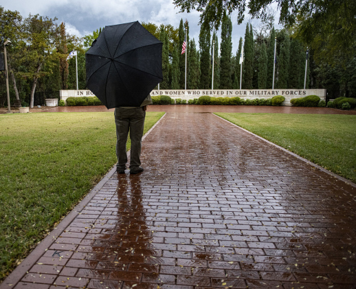 On a rainy and chilly Veterans Day, 62-year-old Navy veteran Calvin Sears of La Vernia, pays a visit to the Georgetown-Williamson County Veterans Memorial Plaza. The observance was held indoors this year, but since this was his first time to attend this observance, he wanted to see the Memorial Plaza.