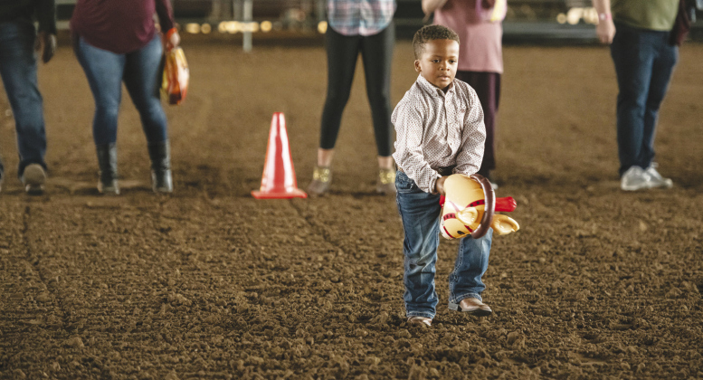 Jaxon Horn, 4, participates in the fair’s inaugural stick-horse riding competition.