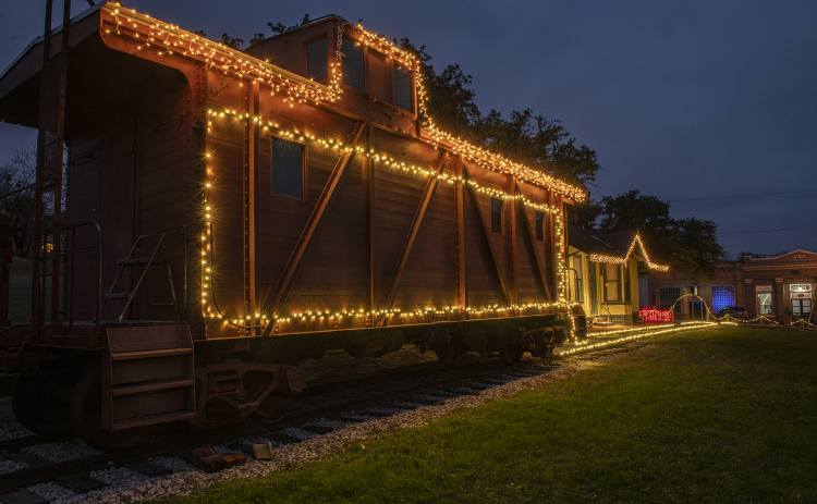 The community of Coupland is decked out for the Christmas holiday season with lights around the depot, caboose and tracks Sunday, December 11. (Photos by Andy Sharp)  